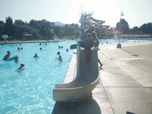 Geneveve goes down the kid water slide