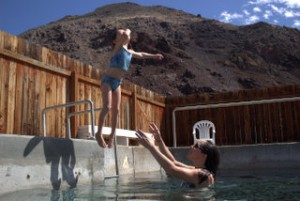 Geneveve gets brave jumping into the water at Challis Hot Springs