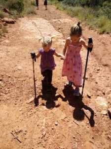 Geneveve shows Xena how to use hiking poles