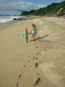 Sisters walking hand in hand